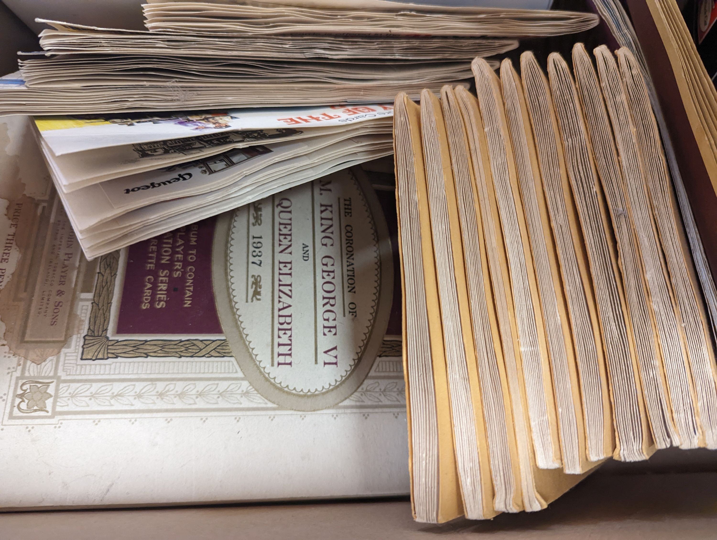 A quantity of First Day Covers and cigarette cards